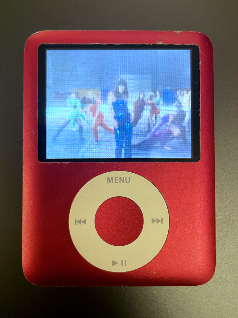 My red iPod nano (3rd generation) playing the music video for 1234 by Feist.
