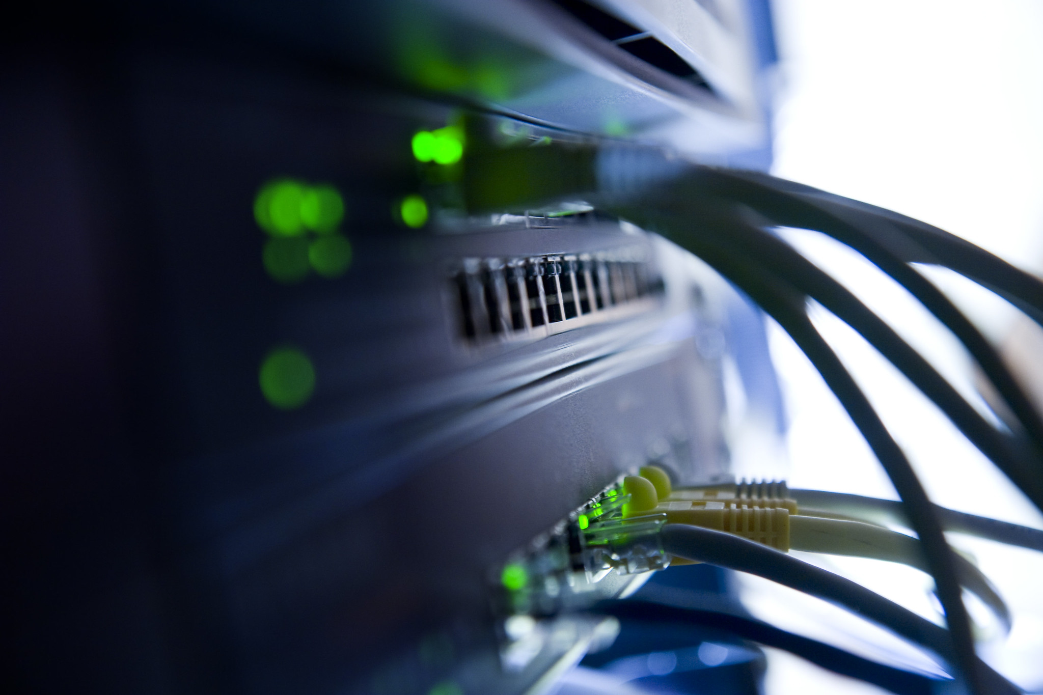 A pair of Netgear Ethernet switches in a server rack.